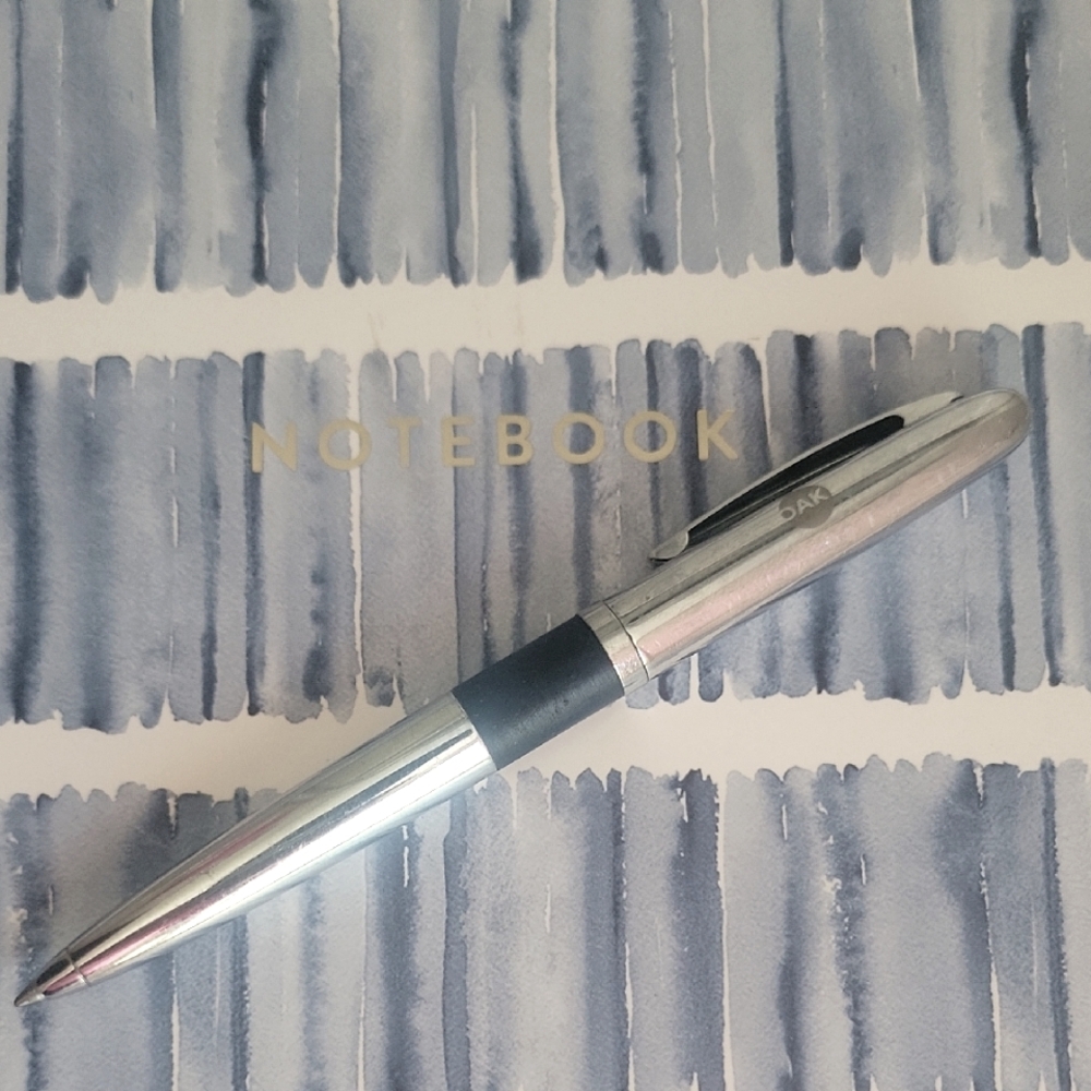 Genuine Clip Art Silver and Black Ballpoint Pen